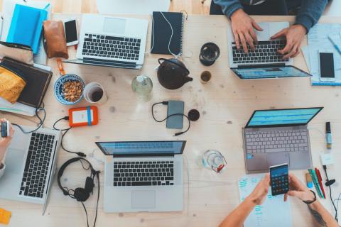 many laptops at desk